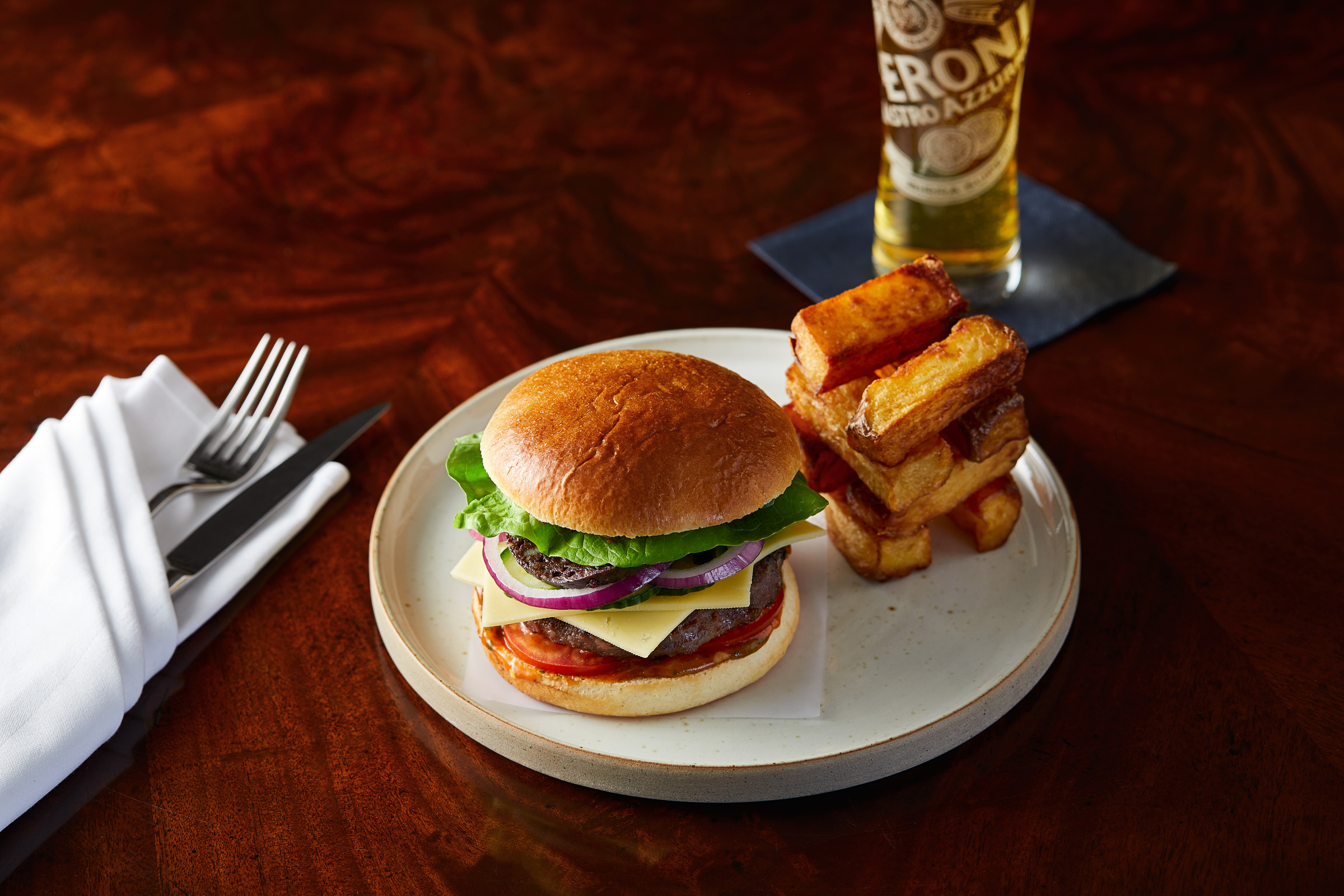 Black Pudding Burger with a pint of Peroni at Macdonald Drumossie Hotel, Alastair Ferrier photographer.