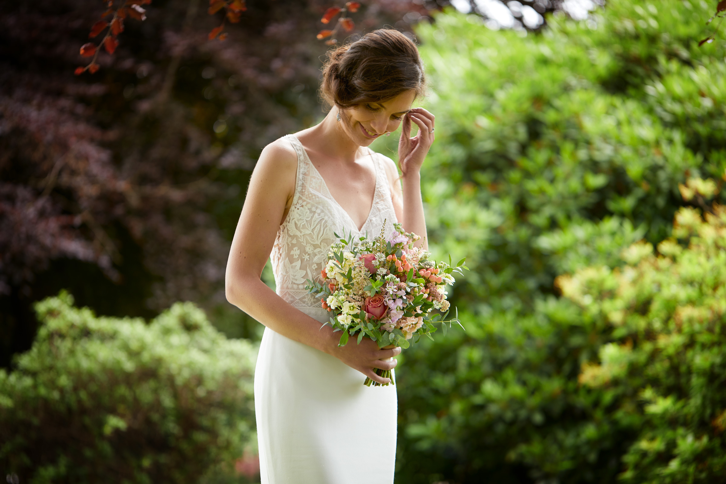 Bride in the Garden at Houston House Hotel. Lifestyle photographer Alastair Ferrier for Macdonald Hotels.