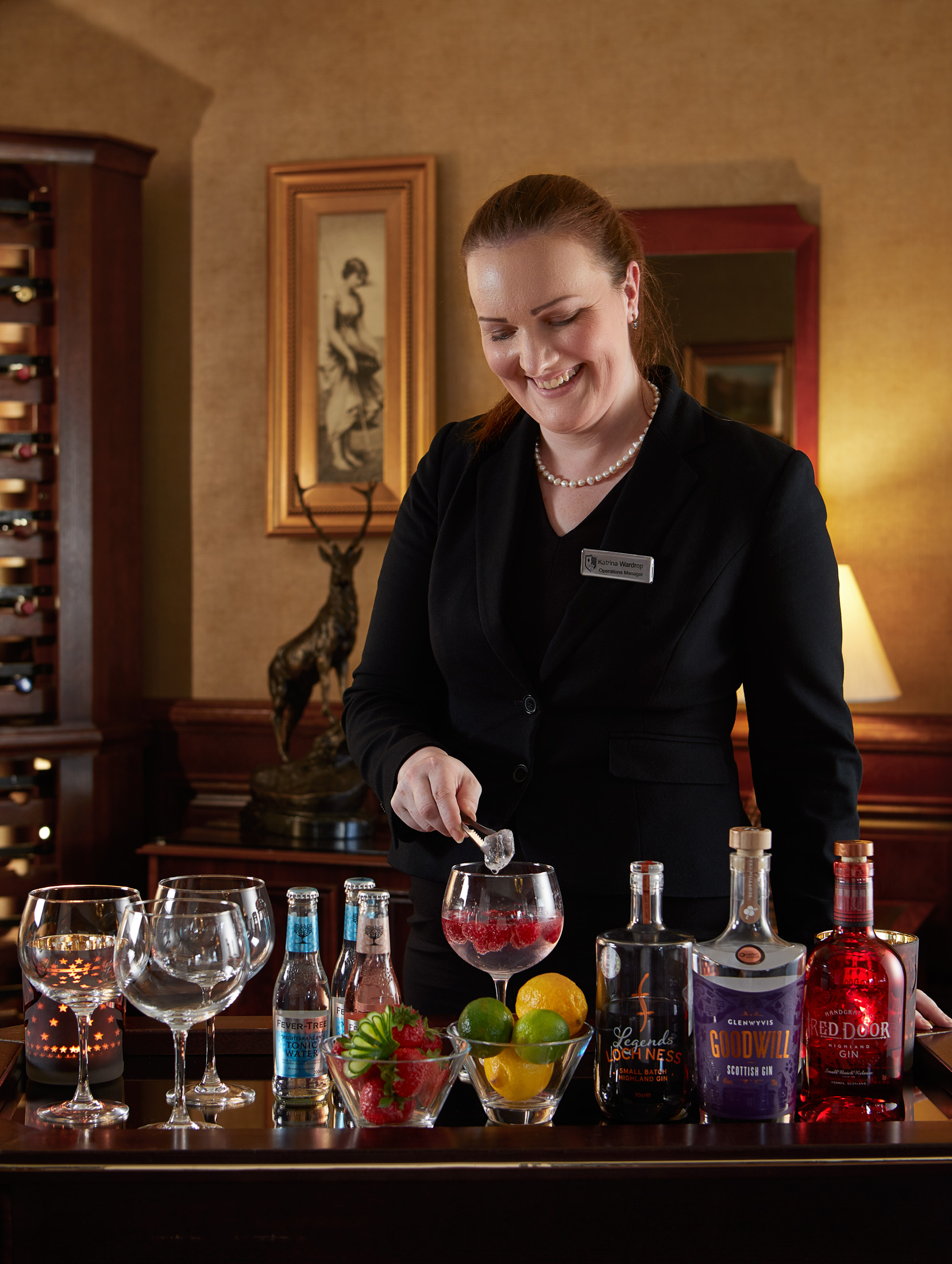 Making Gin and tonic at a drinks trolley at Macdonald Drumossie Hotel, location drinks photographer Alastair Ferrier