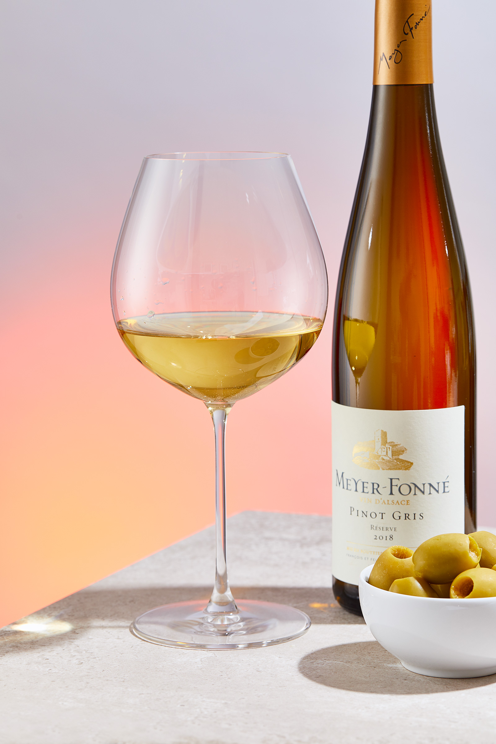 Meyer Fonne Pinot Gris Bottle, glass and olives