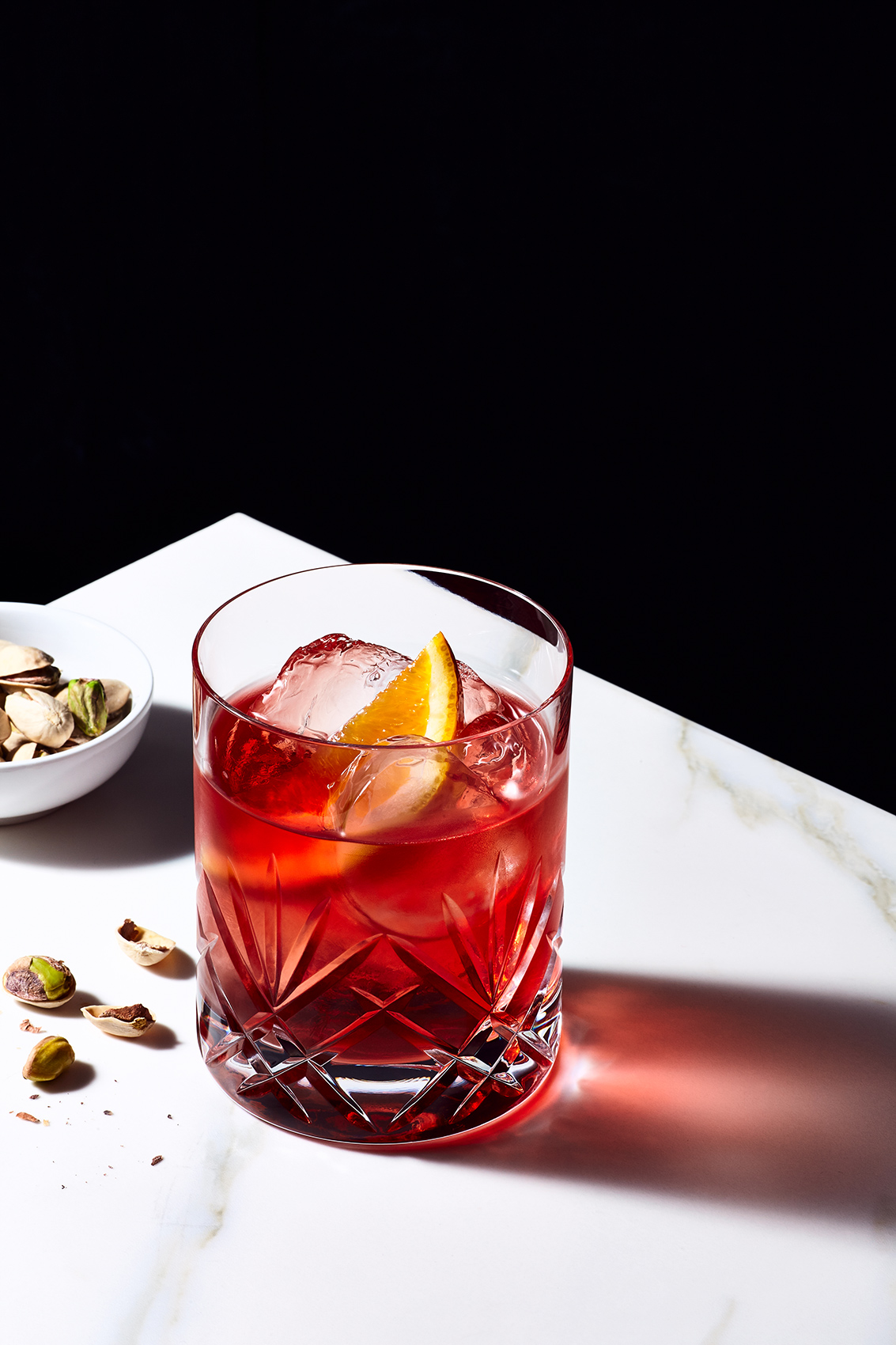 Negroni Cocktail and pistachios.
