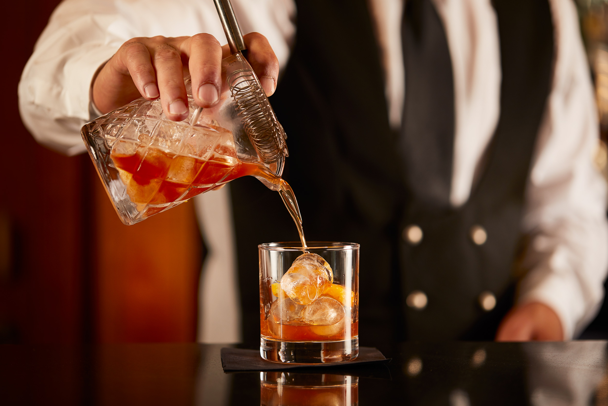 Pour of an Old Fashioned at Bath Spa Hotel. Alastair Ferrier photographer, food and drink photographer.